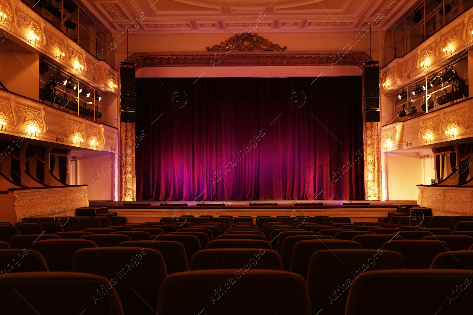 Photo of Theatre interior with stage and rows of comfortable seats