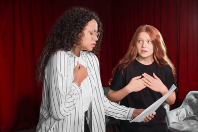 Photo of Professional actors rehearsing on stage in theatre