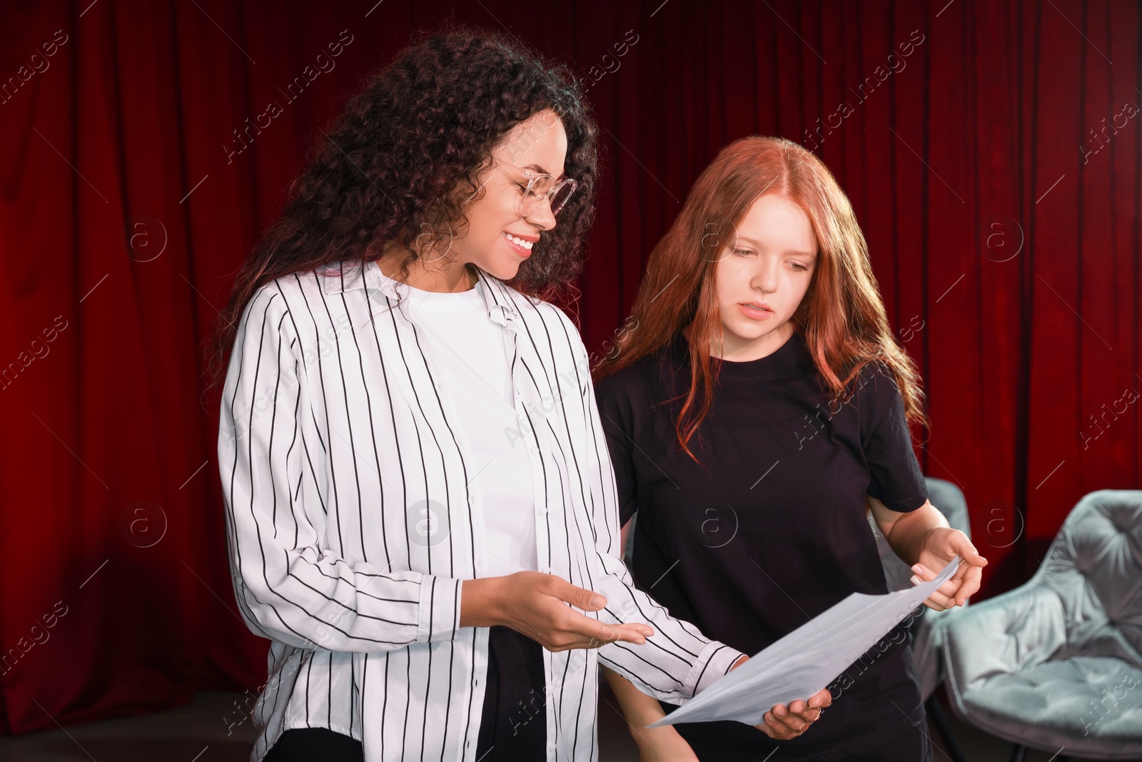 Photo of Professional actors rehearsing on stage in theatre