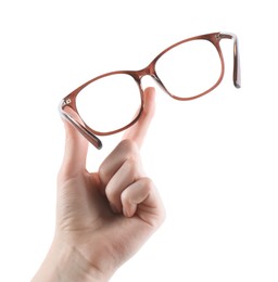 Photo of Woman holding glasses with brown frame on white background, closeup