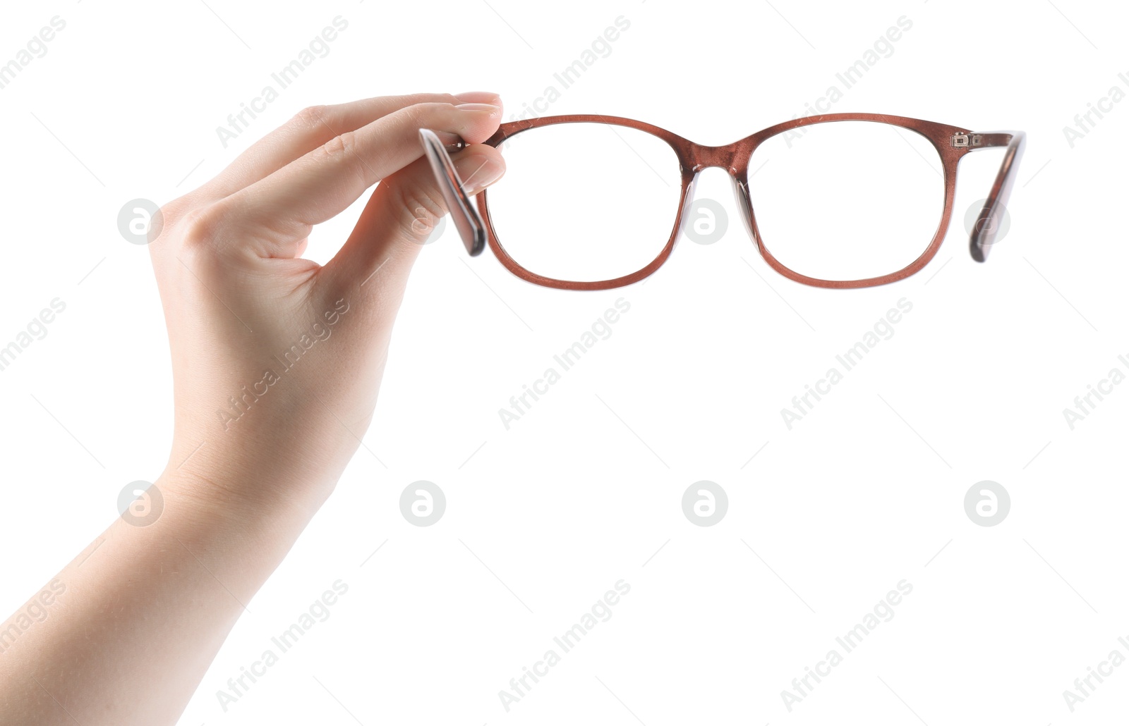 Photo of Woman holding glasses with brown frame on white background, closeup