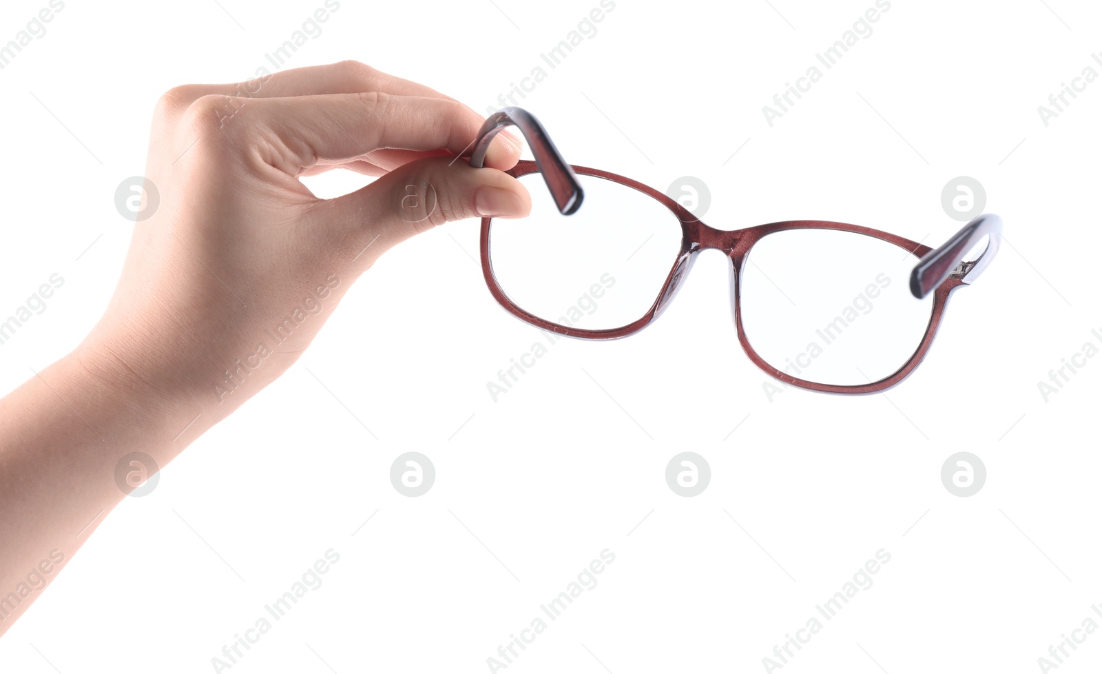 Photo of Woman holding glasses with brown frame on white background, closeup