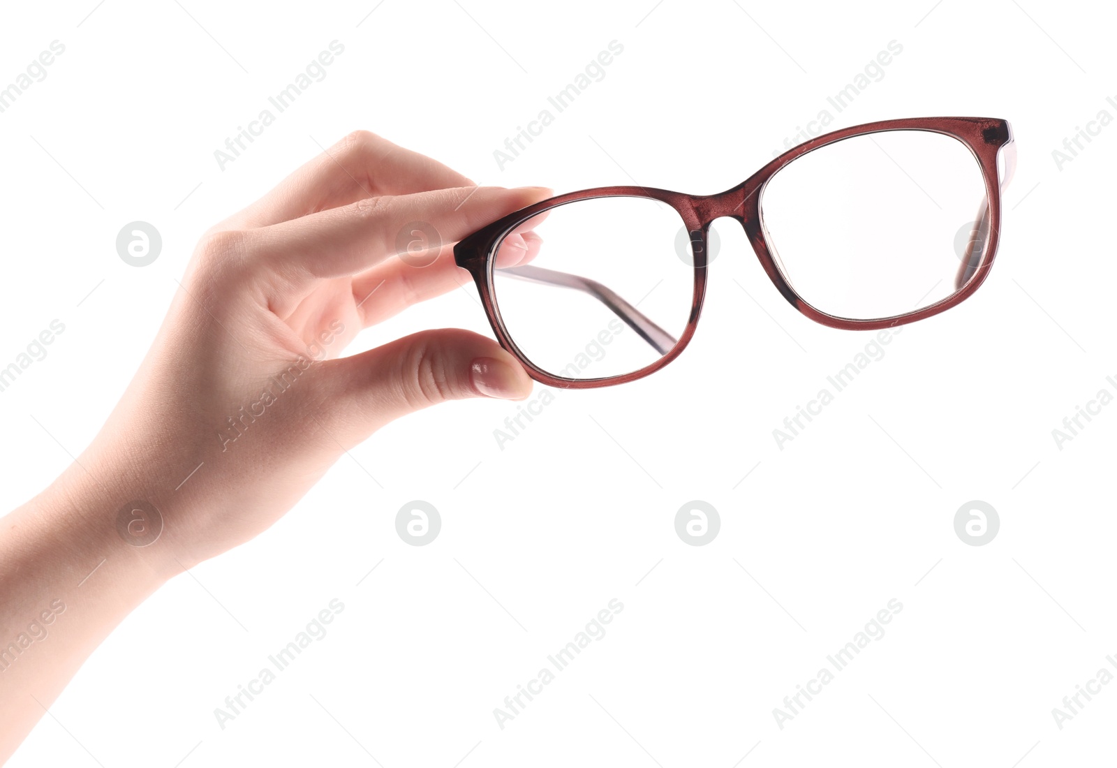 Photo of Woman holding glasses with brown frame on white background, closeup