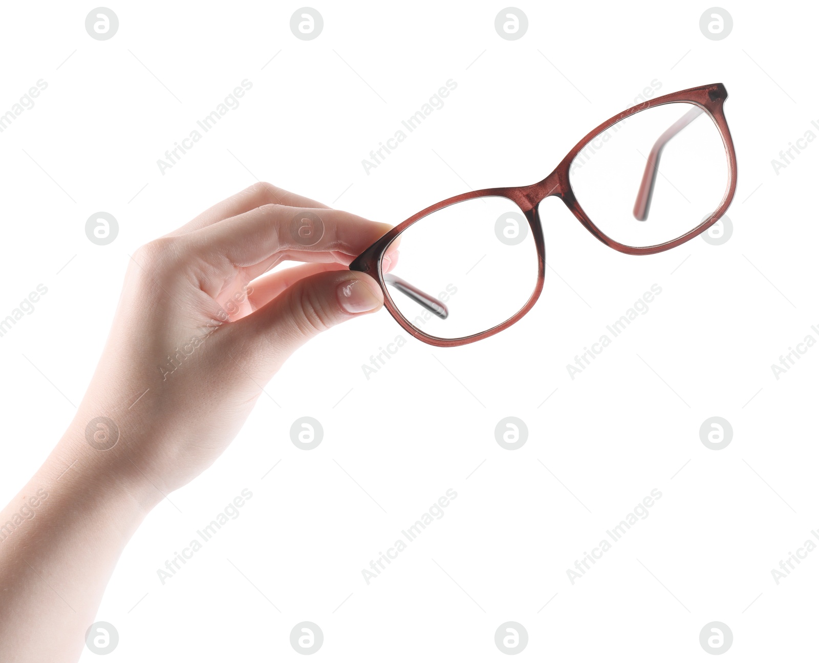 Photo of Woman holding glasses with brown frame on white background, closeup