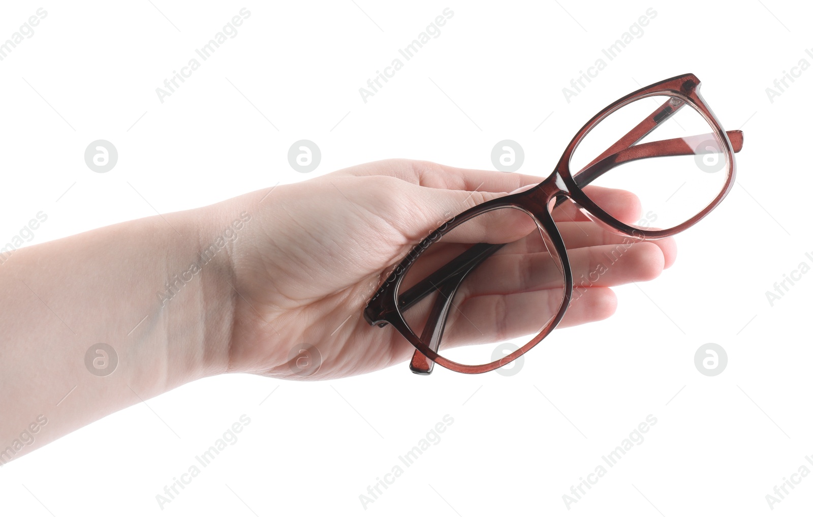 Photo of Woman holding glasses with brown frame on white background, closeup