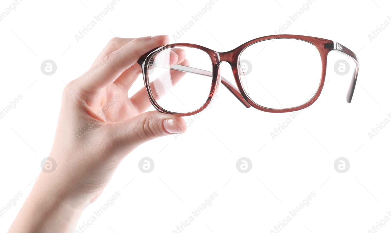 Photo of Woman holding glasses with brown frame on white background, closeup