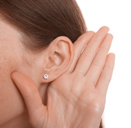 Photo of Woman showing hand to ear gesture on white background, closeup