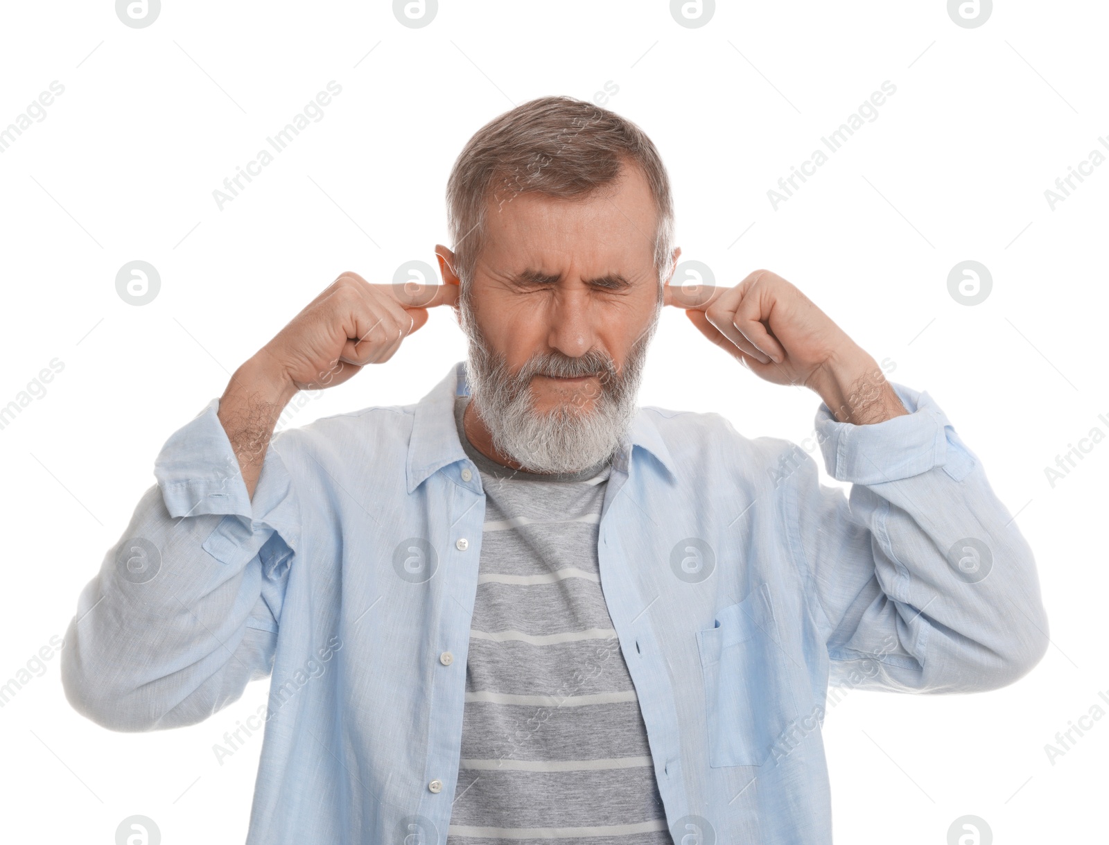 Photo of Senior man covering his ears with fingers on white background