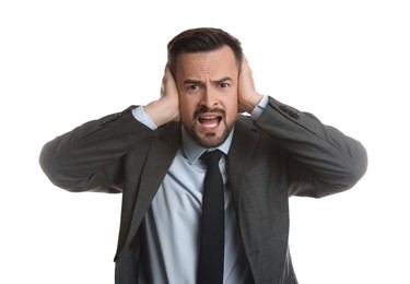 Photo of Man covering his ears on white background