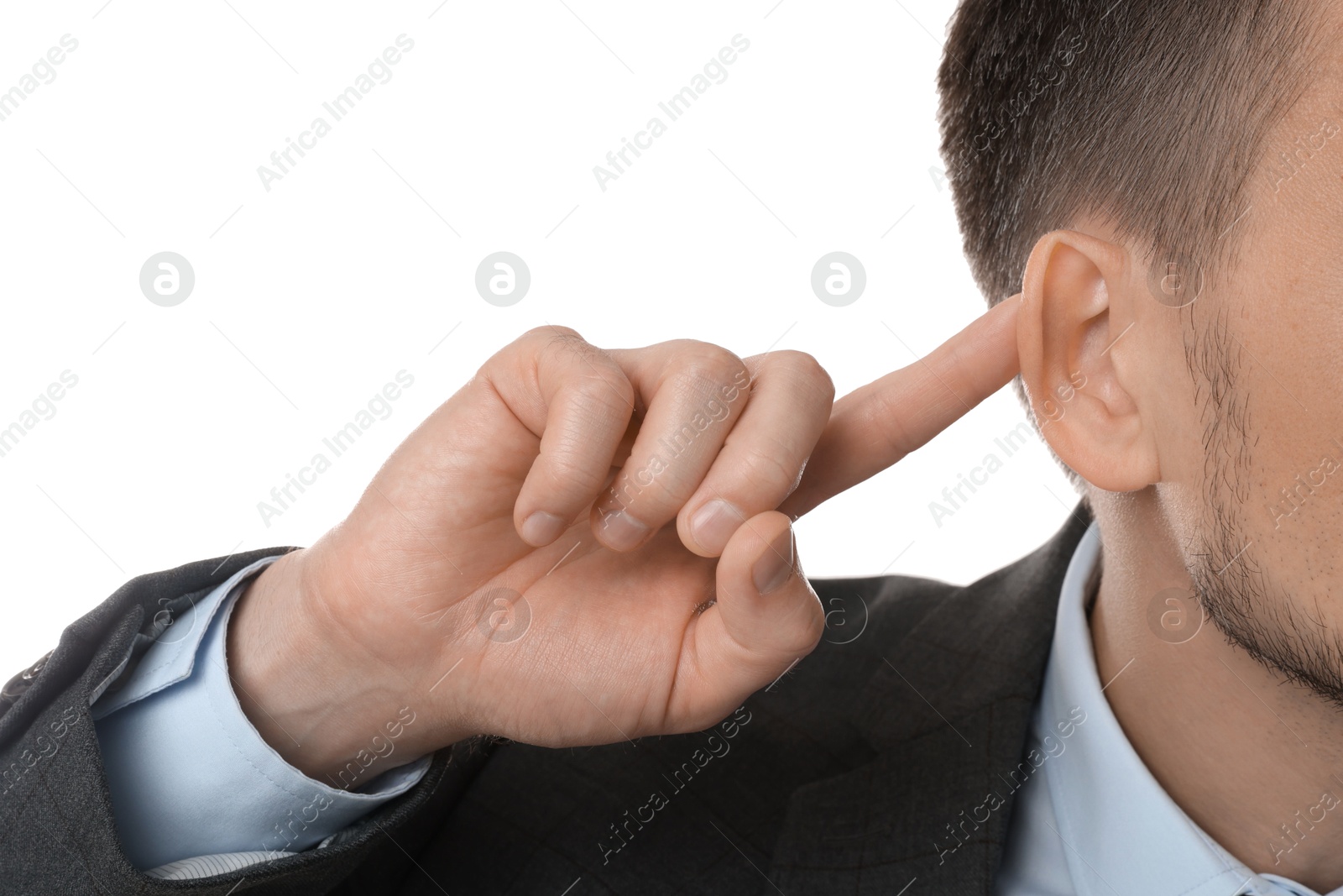 Photo of Man showing hand to ear gesture on white background, closeup