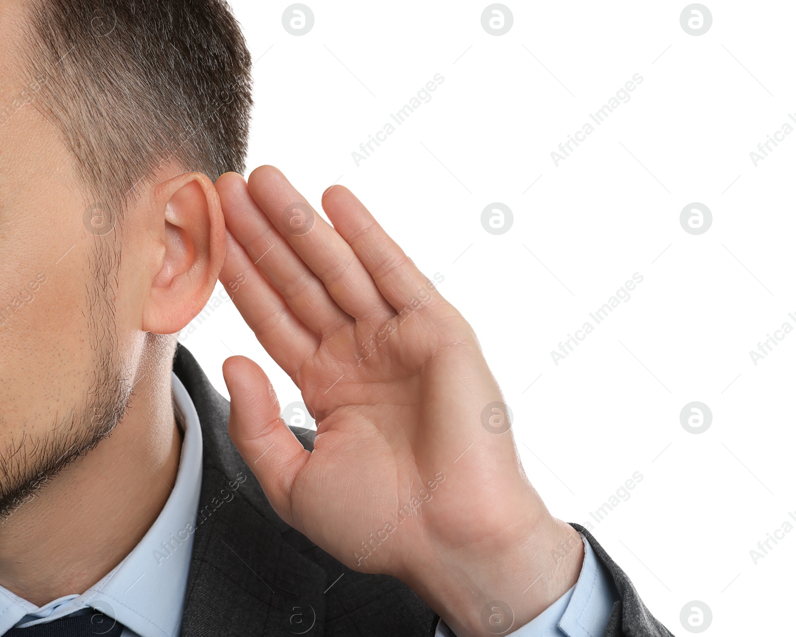 Photo of Man showing hand to ear gesture on white background, closeup