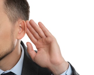 Photo of Man showing hand to ear gesture on white background, closeup