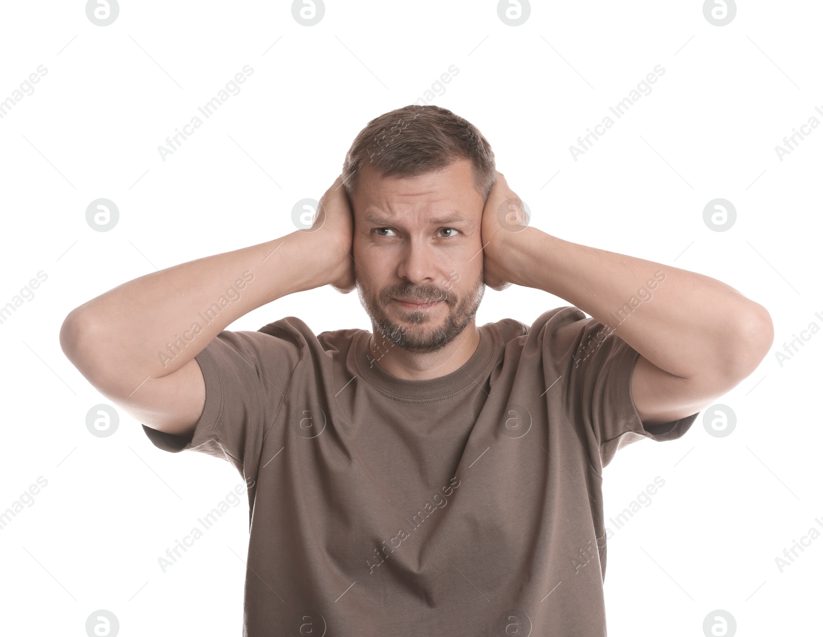 Photo of Man covering his ears on white background