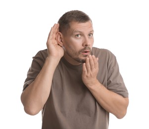 Photo of Man showing hand to ear gesture on white background