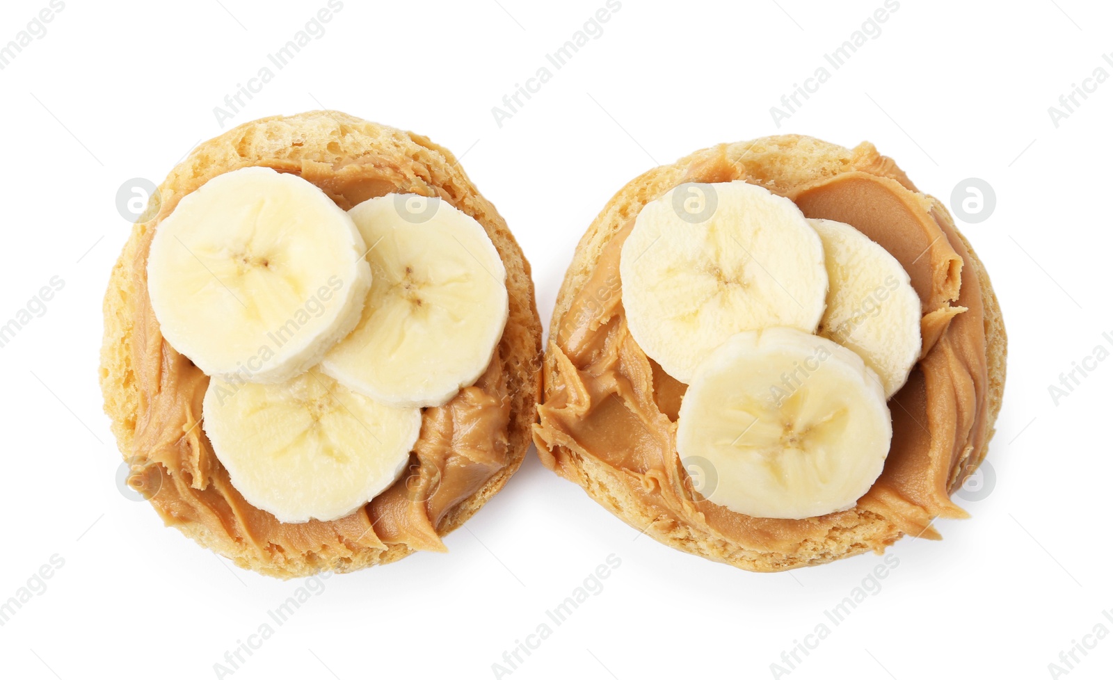 Photo of Tasty sandwiches with peanut butter and banana isolated on white, top view