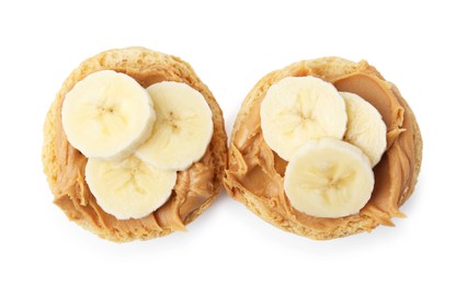 Photo of Tasty sandwiches with peanut butter and banana isolated on white, top view