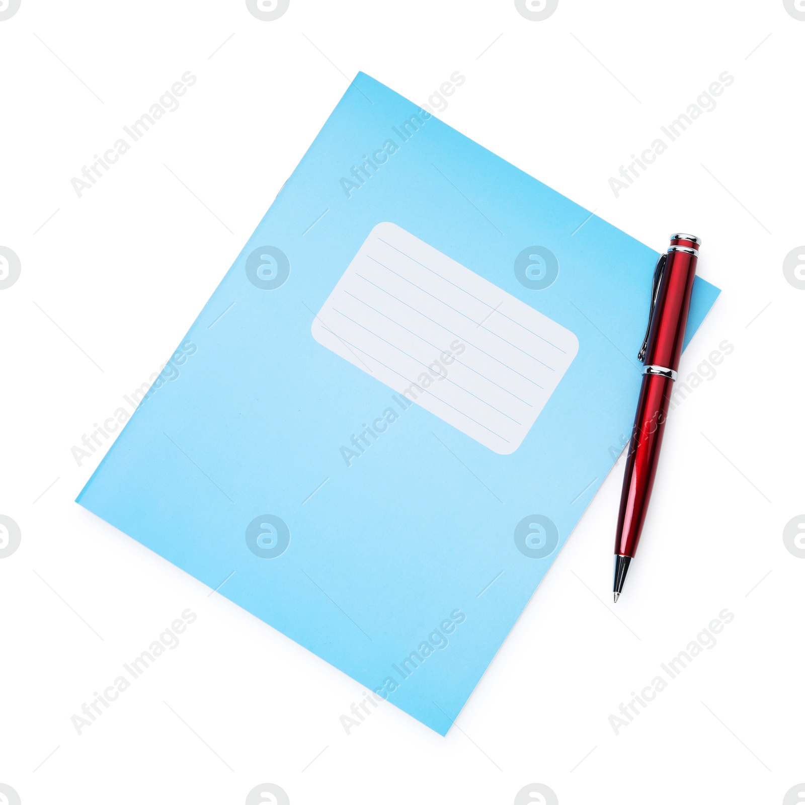 Photo of Copybook and pen isolated on white, top view. School stationery