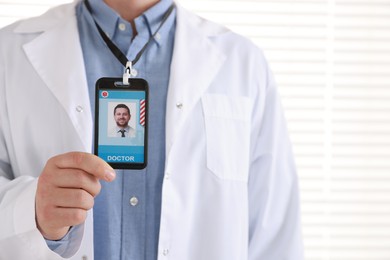 Photo of Doctor with badge in hospital, closeup view