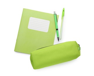 Photo of Copybook, pencil case and pens on white background, top view