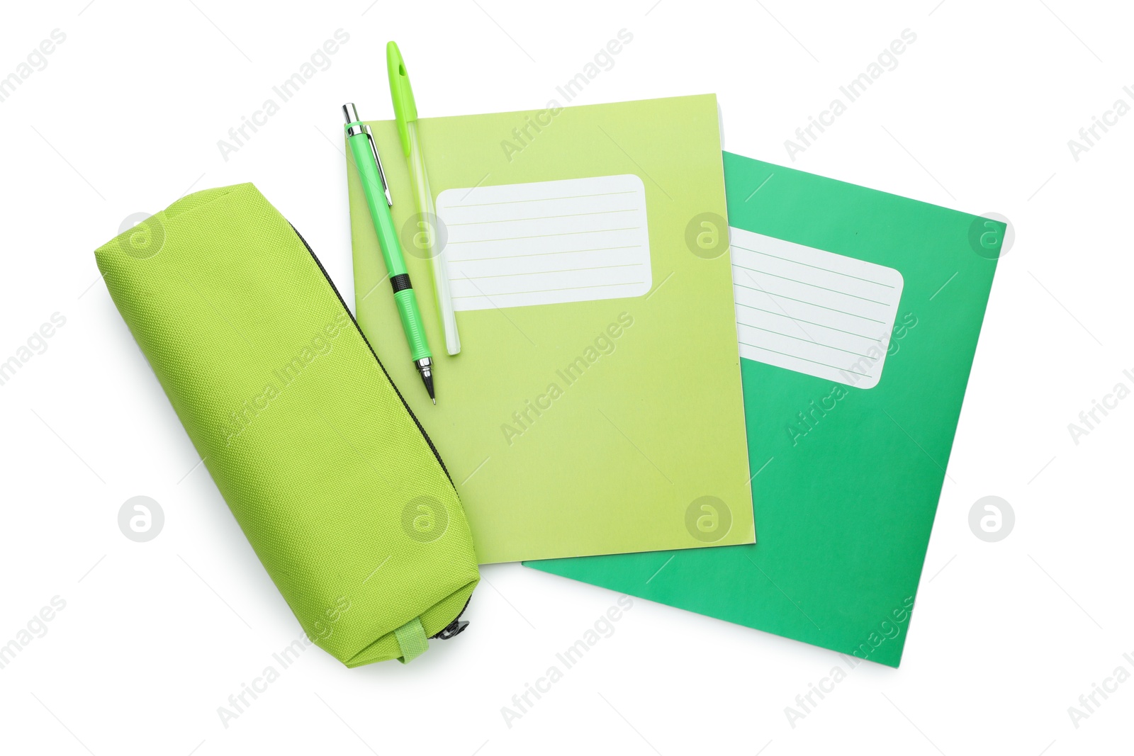 Photo of Copybooks, pencil case and pens on white background, top view