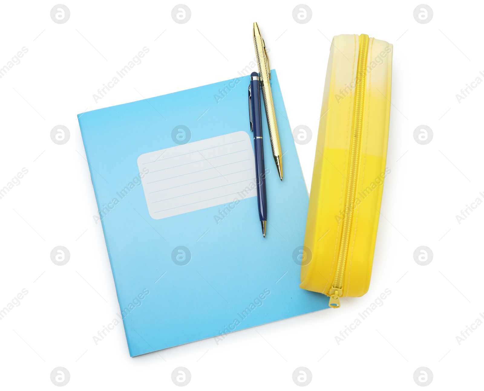 Photo of Copybook, pencil case and pens on white background, top view