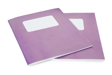 Photo of Two purple copybooks isolated on white. School stationery