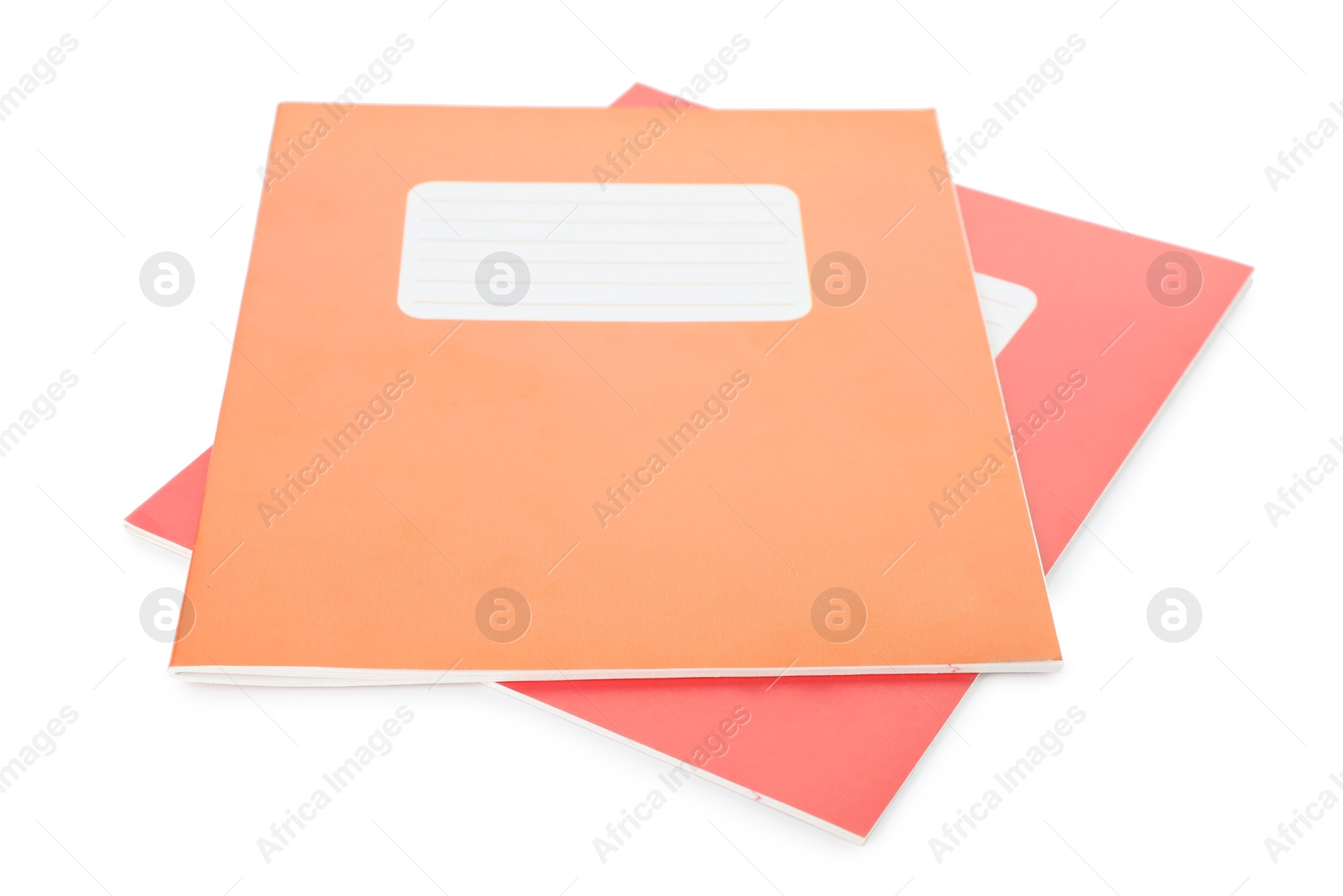 Photo of Orange and red copybooks isolated on white