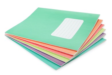 Photo of Stack of colorful copybooks isolated on white