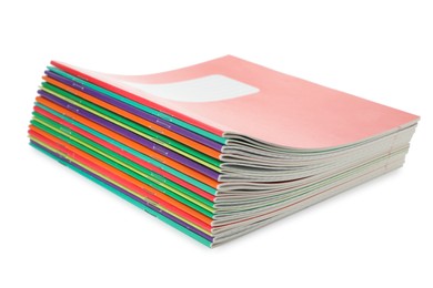 Photo of Stack of colorful copybooks isolated on white