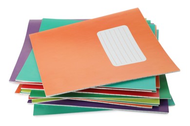 Photo of Stack of colorful copybooks isolated on white