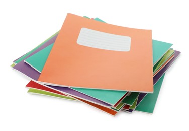 Photo of Stack of colorful copybooks isolated on white