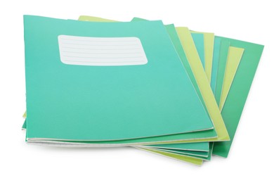 Photo of Stack of colorful copybooks isolated on white