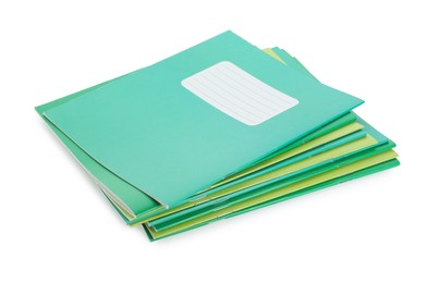 Photo of Stack of colorful copybooks isolated on white