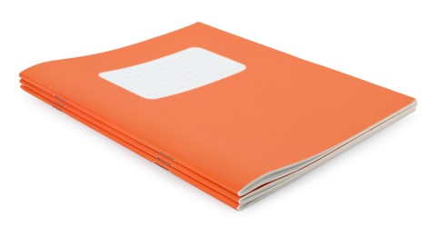 Photo of Orange copybooks isolated on white. School stationery