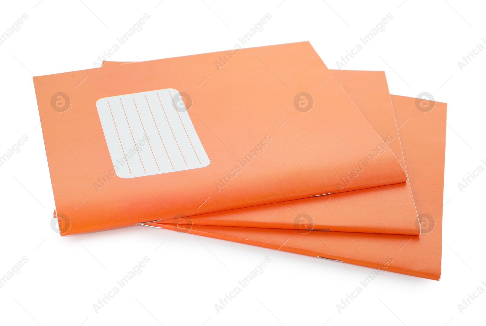 Photo of Orange copybooks isolated on white. School stationery