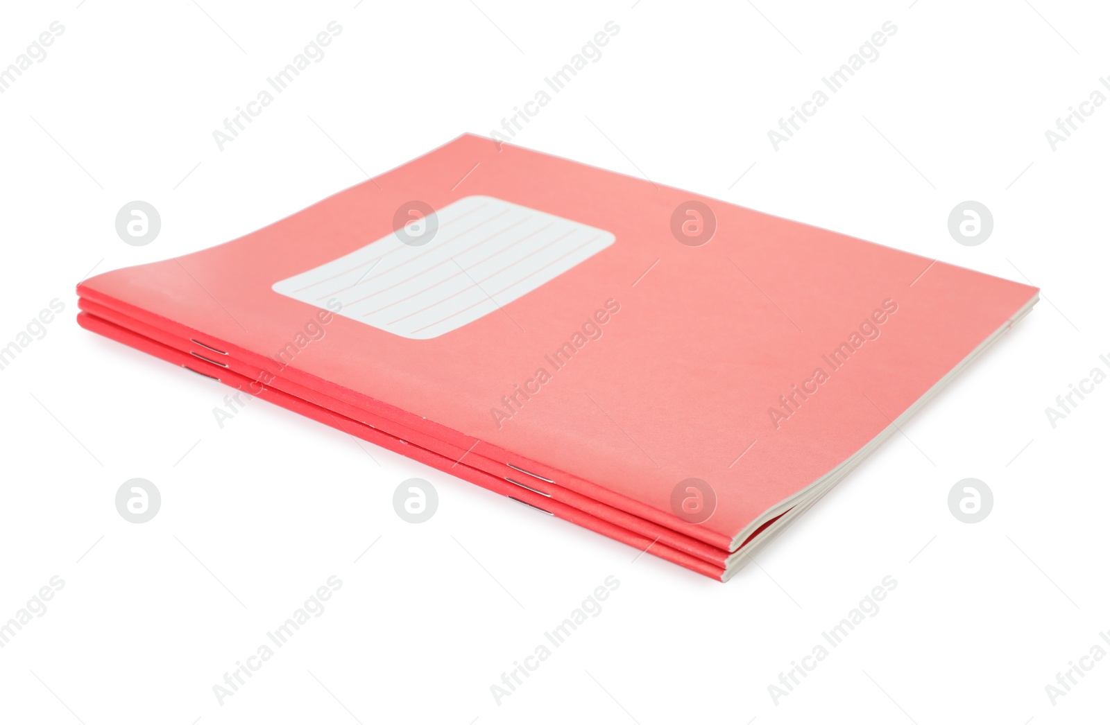 Photo of Red copybooks isolated on white. School stationery