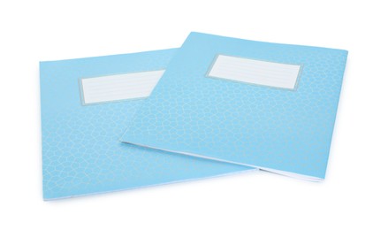 Photo of Light blue copybooks isolated on white. School stationery