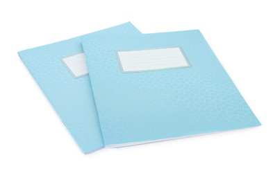 Photo of Light blue copybooks isolated on white. School stationery