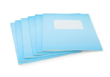 Photo of Light blue copybooks isolated on white. School stationery