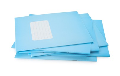 Photo of Stack of copybooks isolated on white. School stationery