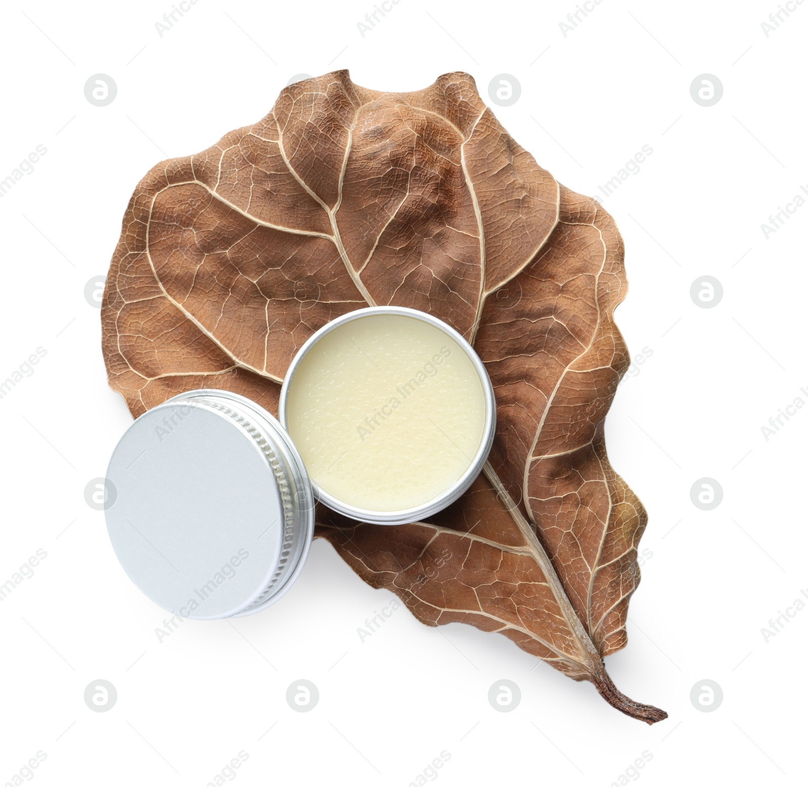 Photo of Natural solid perfume and dry leaf isolated on white, top view