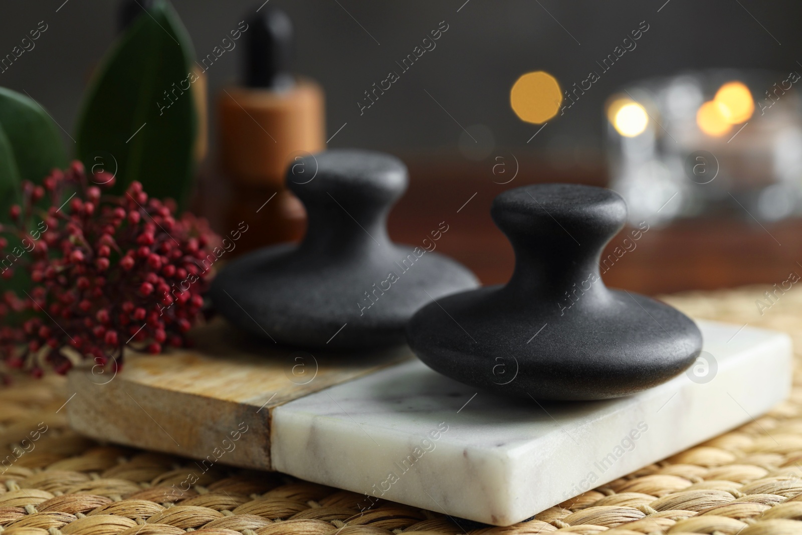 Photo of Spa stones and floral decor on table, closeup