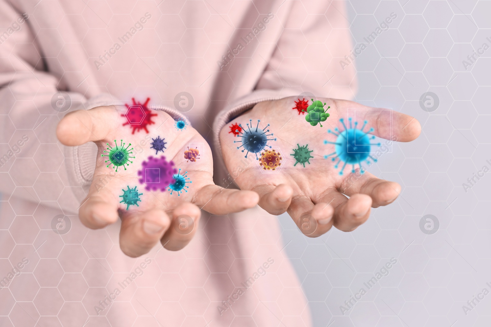 Image of Man showing hands with microbes on grey background, closeup. Illustration of microorganisms