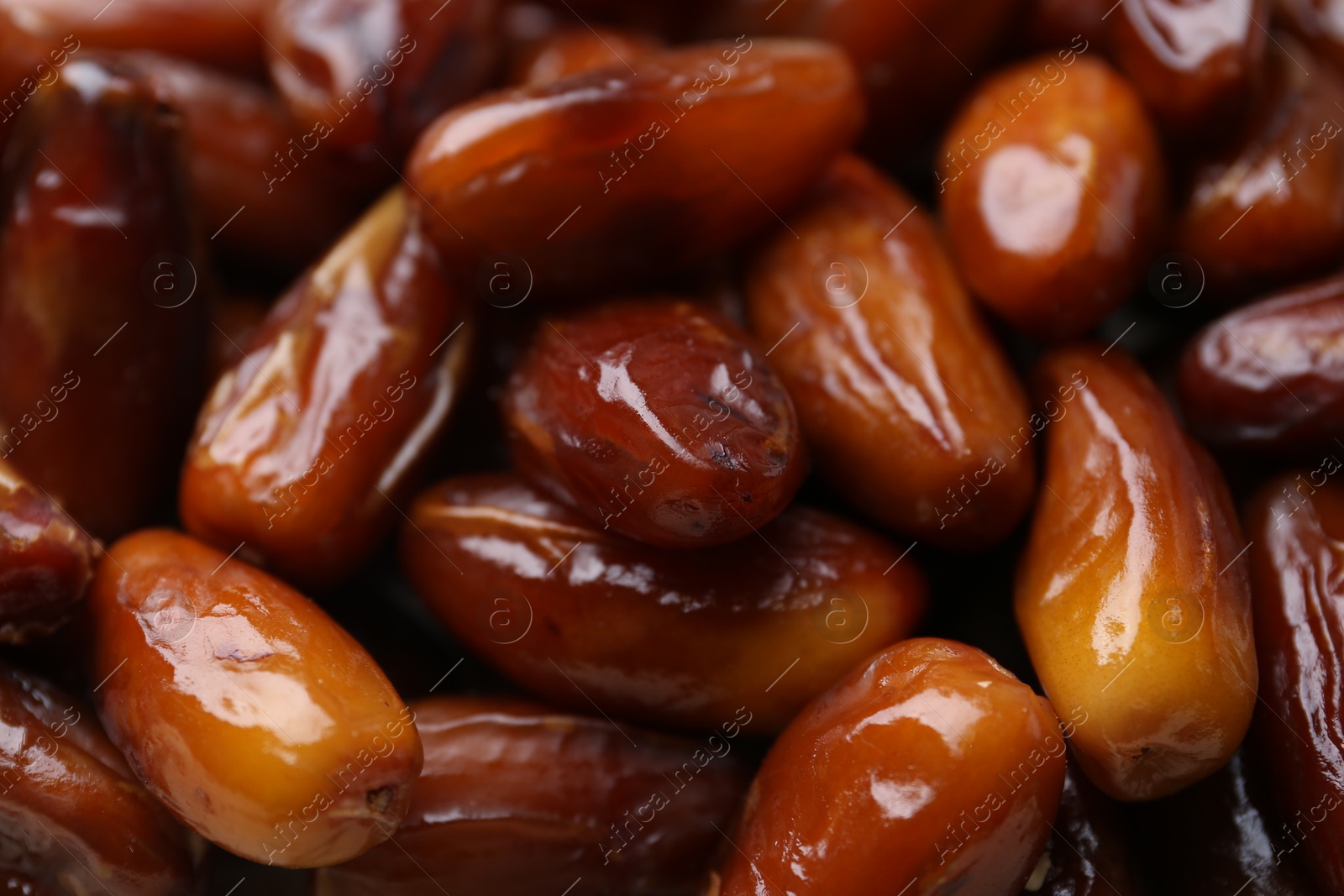 Photo of Tasty sweet dried dates as background, closeup