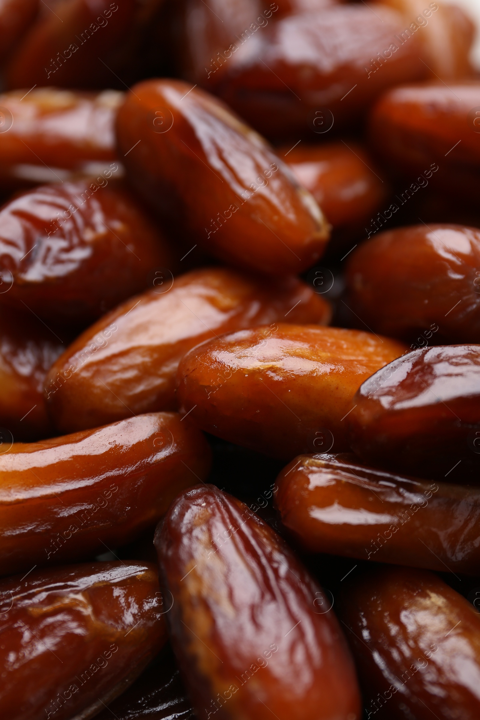 Photo of Tasty sweet dried dates as background, closeup