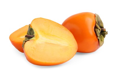 Whole and cut fresh persimmons isolated on white