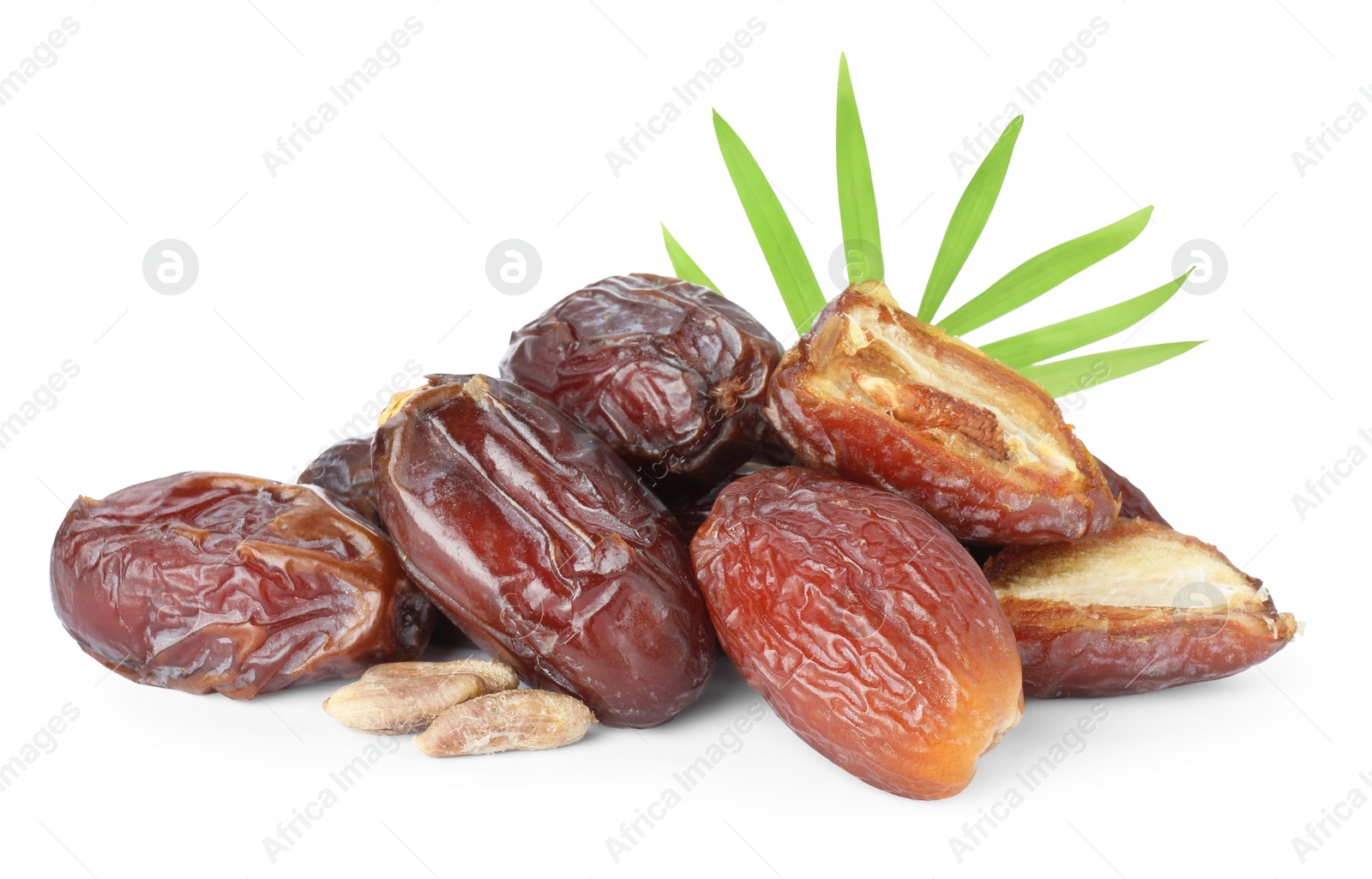 Photo of Tasty dried dates, seeds and leaf isolated on white