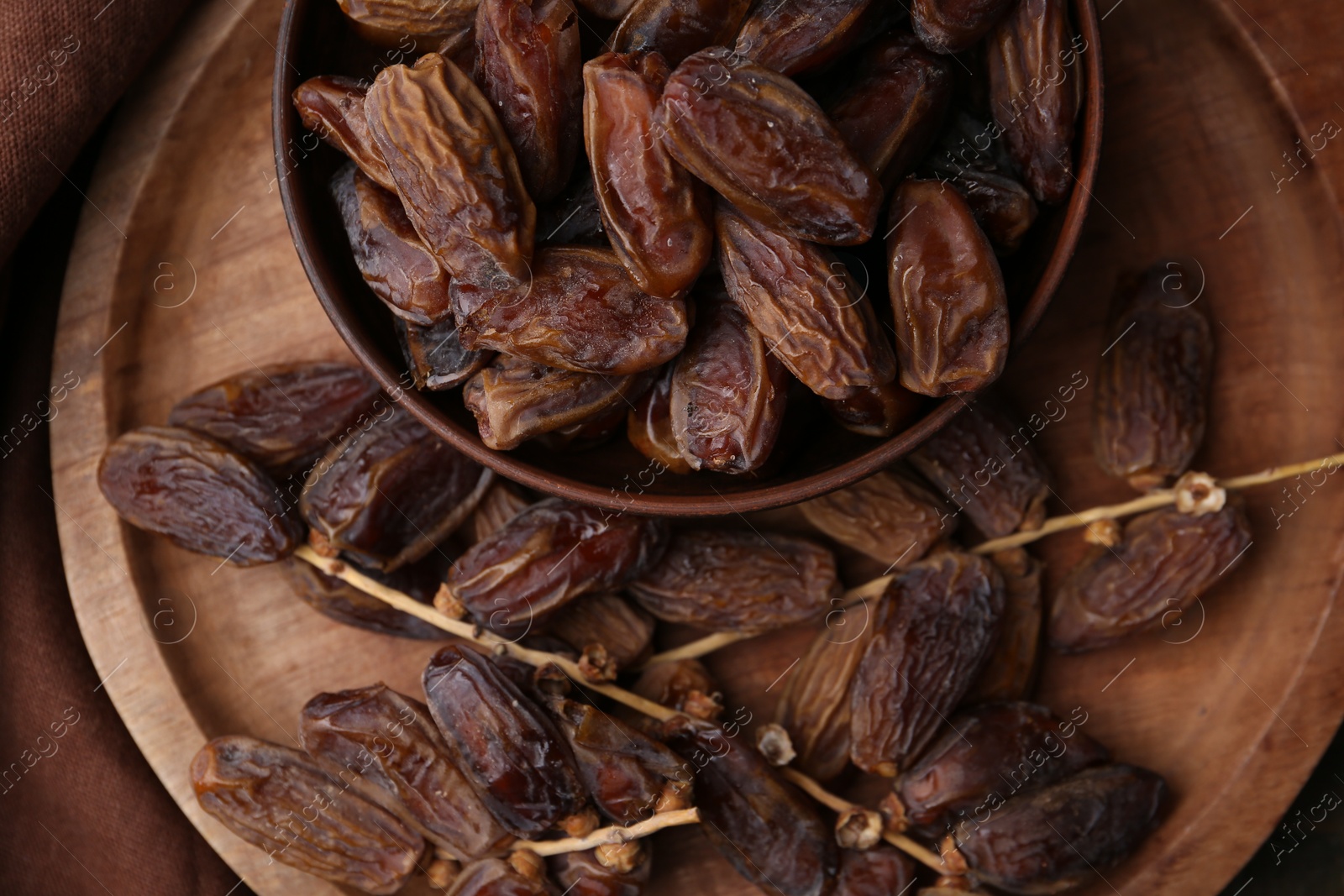 Photo of Tasty dried dates on wooden table, top view