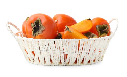 Photo of Ripe persimmons in wicker basket isolated on white