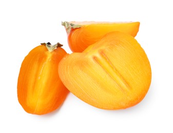 Photo of Pieces of ripe persimmon isolated on white